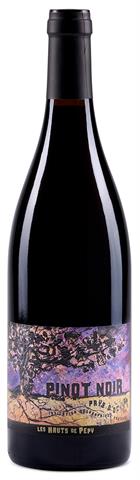 wine bottle with a tree on a purple label